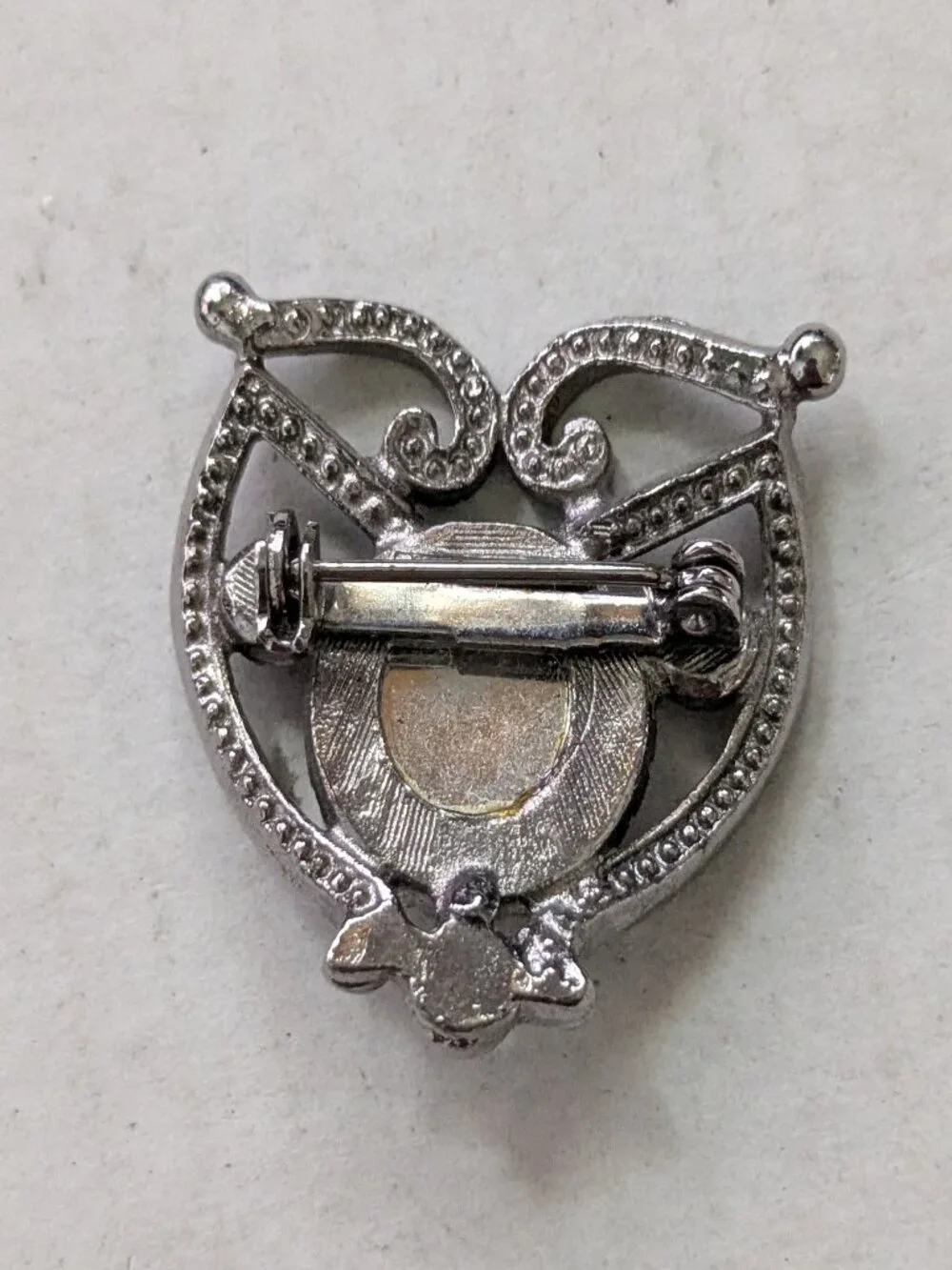 Small Silver Tone Purple Faceted Rhinestone Filigree Brooch Pin